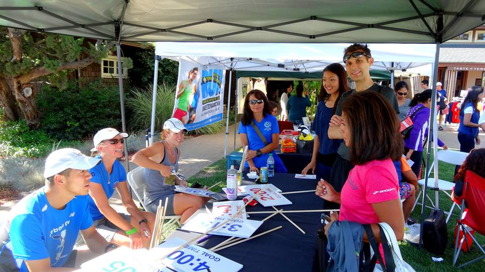 volunteering at the expo and chopping off unnecessary white space on our 3:35 sign. (source: Linh/RA)
