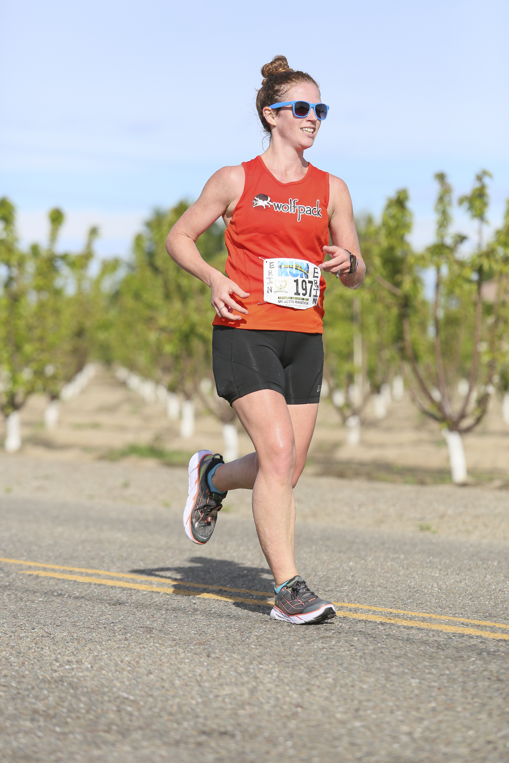 the race caught 15 different images of me, and I have a shit-eating grin in virtually all of them. It's pretty awesome. Note the red face here; it was getting hot. (also: almond trees in the background, perhaps)