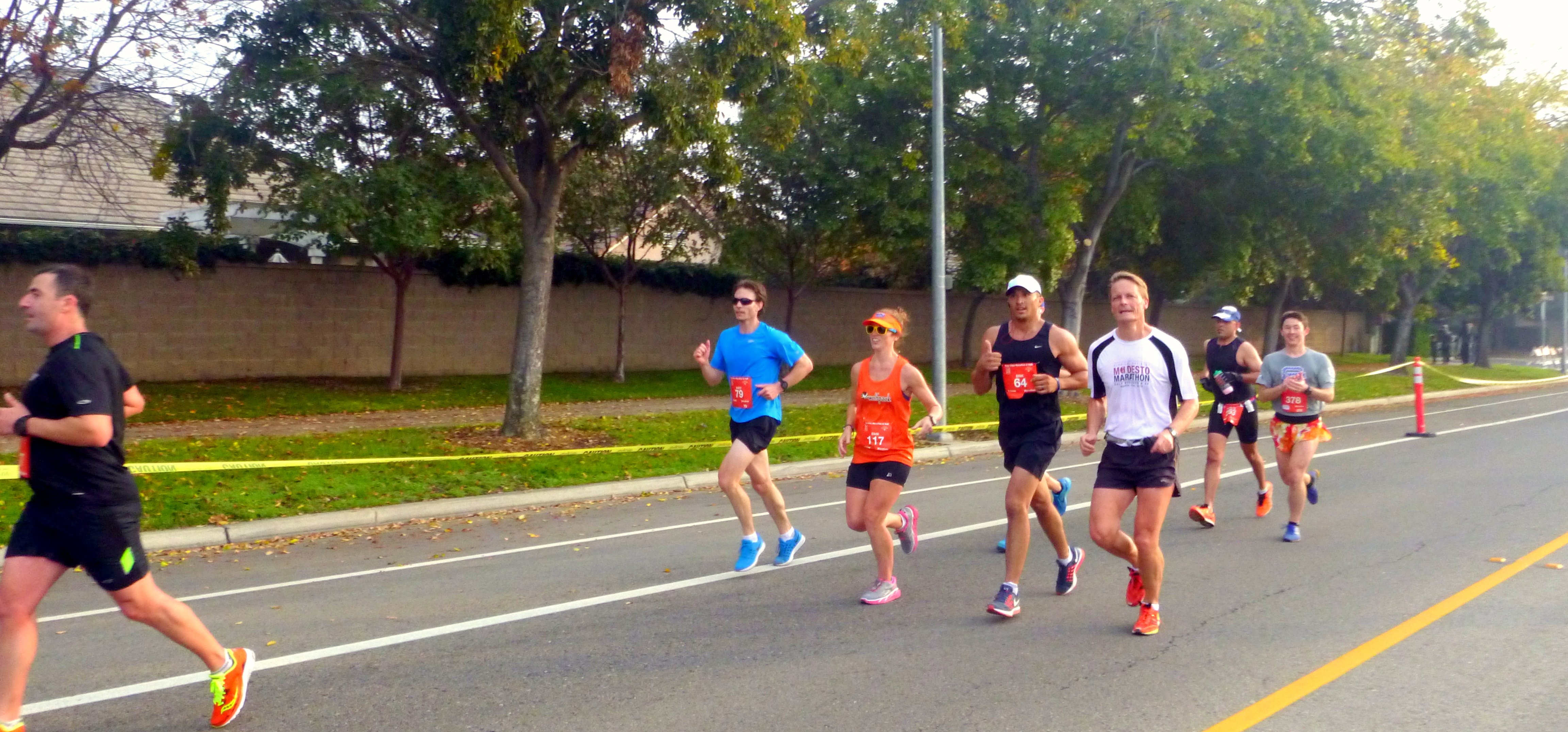 the unofficial 3:20 group. Andy (behind me, in the colorful shorts) and I were together for a long time, and Erik (next to me, all black) was running his first marathon. Plus, he is a cop and knew all the cops in Fresno working the race, so we got lots of banter from the peanut gallery. Pretty entertaining